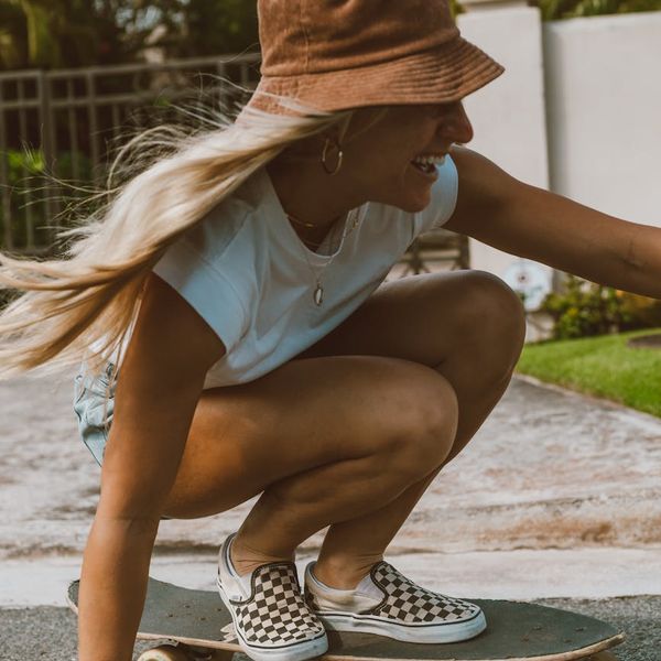 Woman feeling energetic and happy outdoors in the sun.